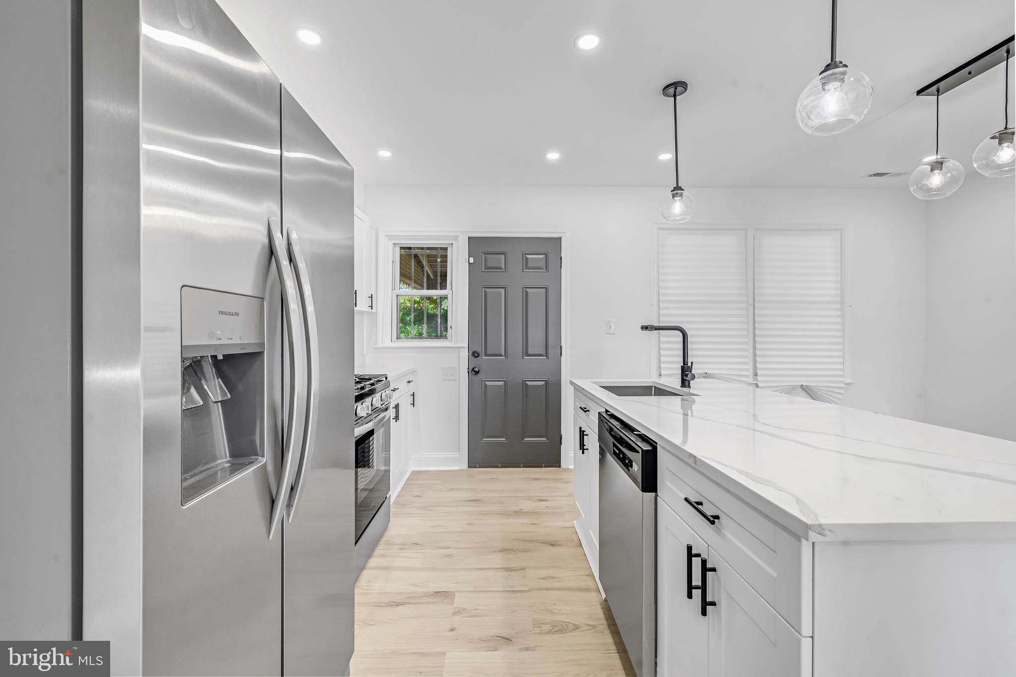 840 Benninghaus Road Baltimore, MD 21212 - Photo 10 of 30 a kitchen with a refrigerator a sink and dishwasher