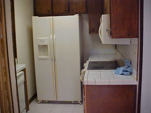 5232 Nimitz Road Milton, FL 32583 - Photo 4 of 8 Tile flooring in kitchen and bath