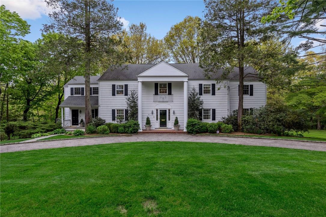 24 Pleasant Ridge Road Harrison, NY 10528 - Photo 1 of 1 a front view of a house with a garden