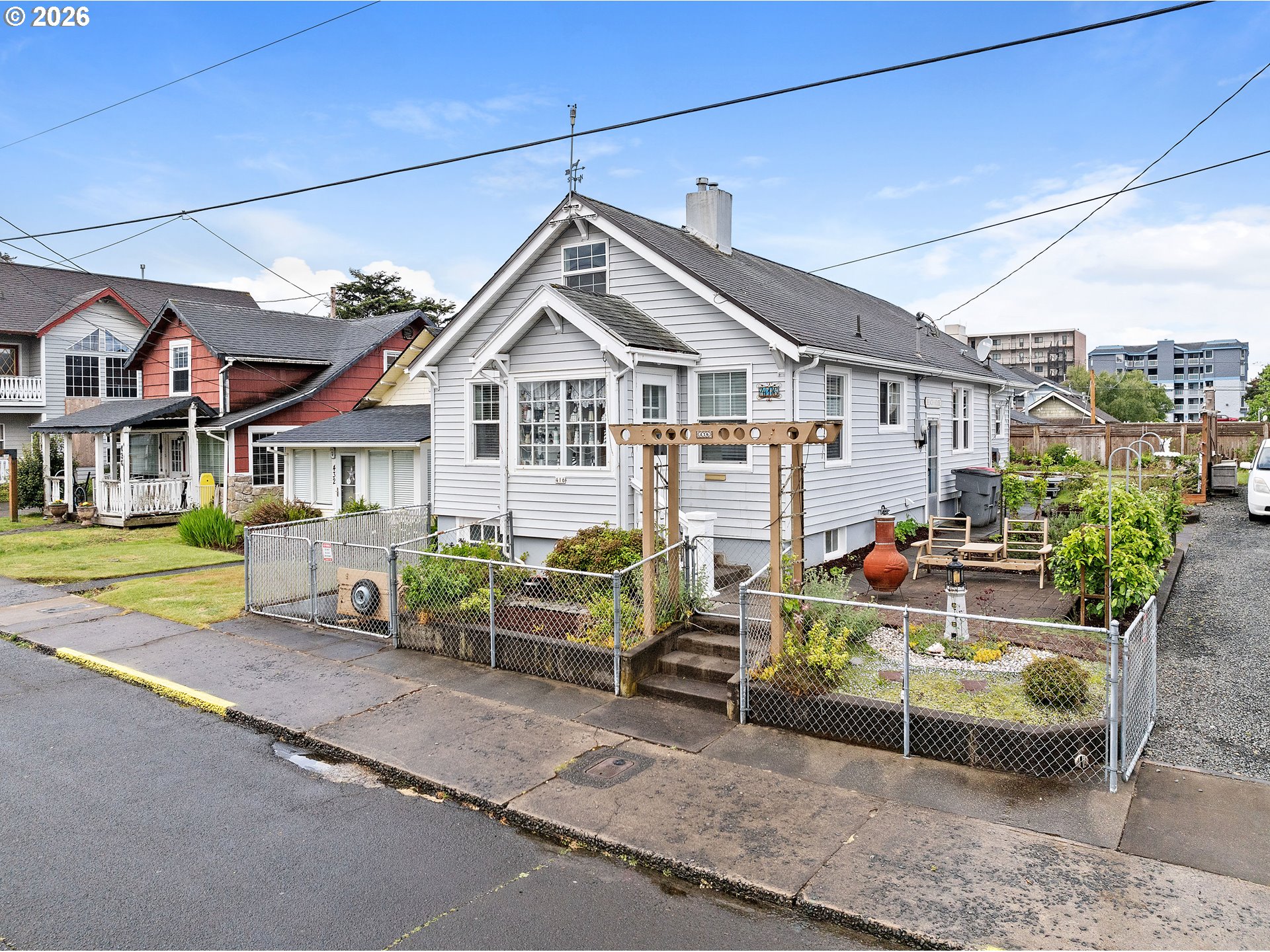 416 South Downing Street Seaside, OR 97138 - Photo 1 of 48 a front view of a house with garden