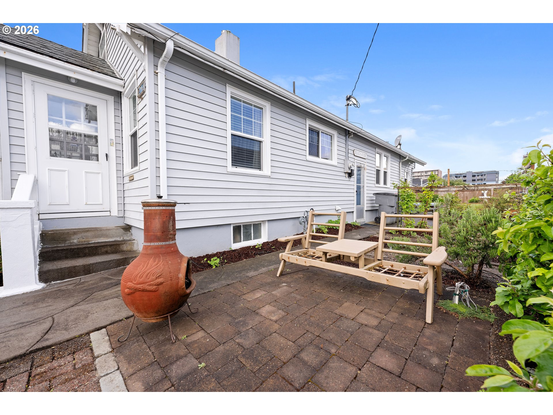 416 South Downing Street Seaside, OR 97138 - Photo 11 of 48 a backyard of a house with outdoor seating