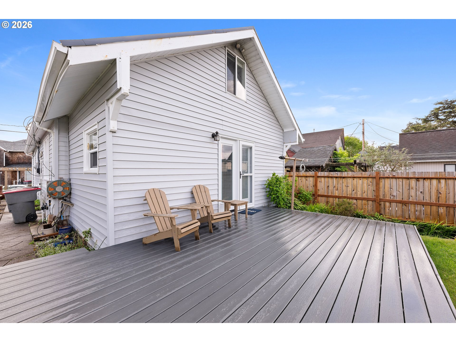 416 South Downing Street Seaside, OR 97138 - Photo 14 of 48 a view of a wooden deck with a bench