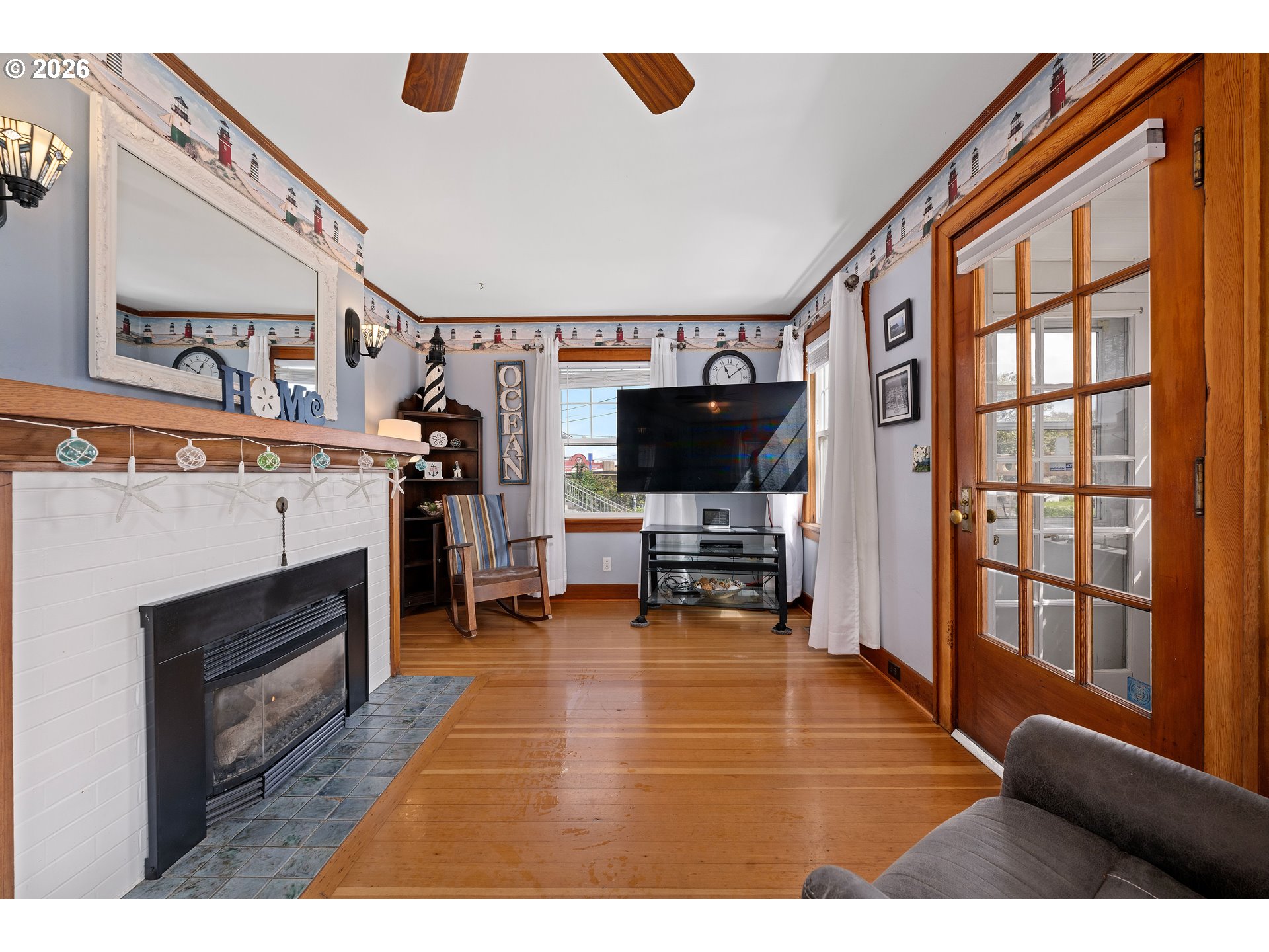 416 South Downing Street Seaside, OR 97138 - Photo 21 of 48 a living room with furniture a flat screen tv and a fireplace