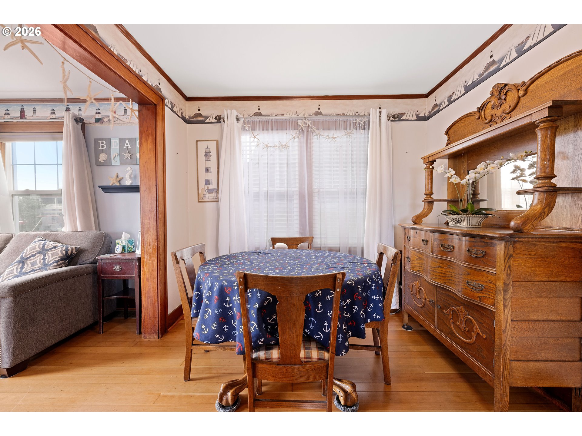 416 South Downing Street Seaside, OR 97138 - Photo 25 of 48 a view of a dining room with furniture and chandelier