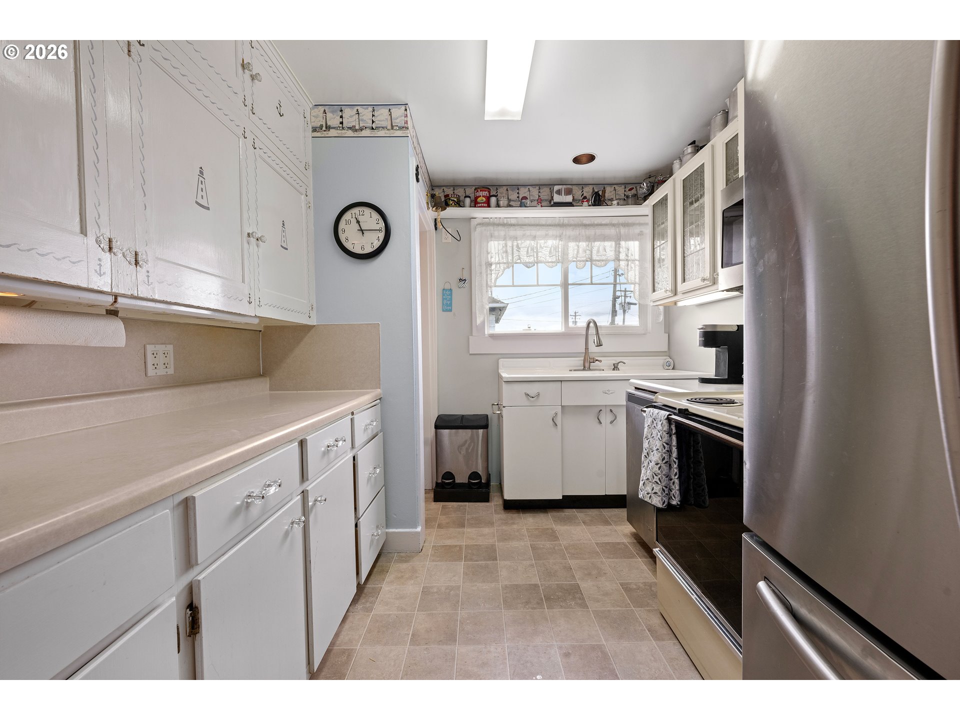 416 South Downing Street Seaside, OR 97138 - Photo 27 of 48 a kitchen with a refrigerator a sink and dishwasher