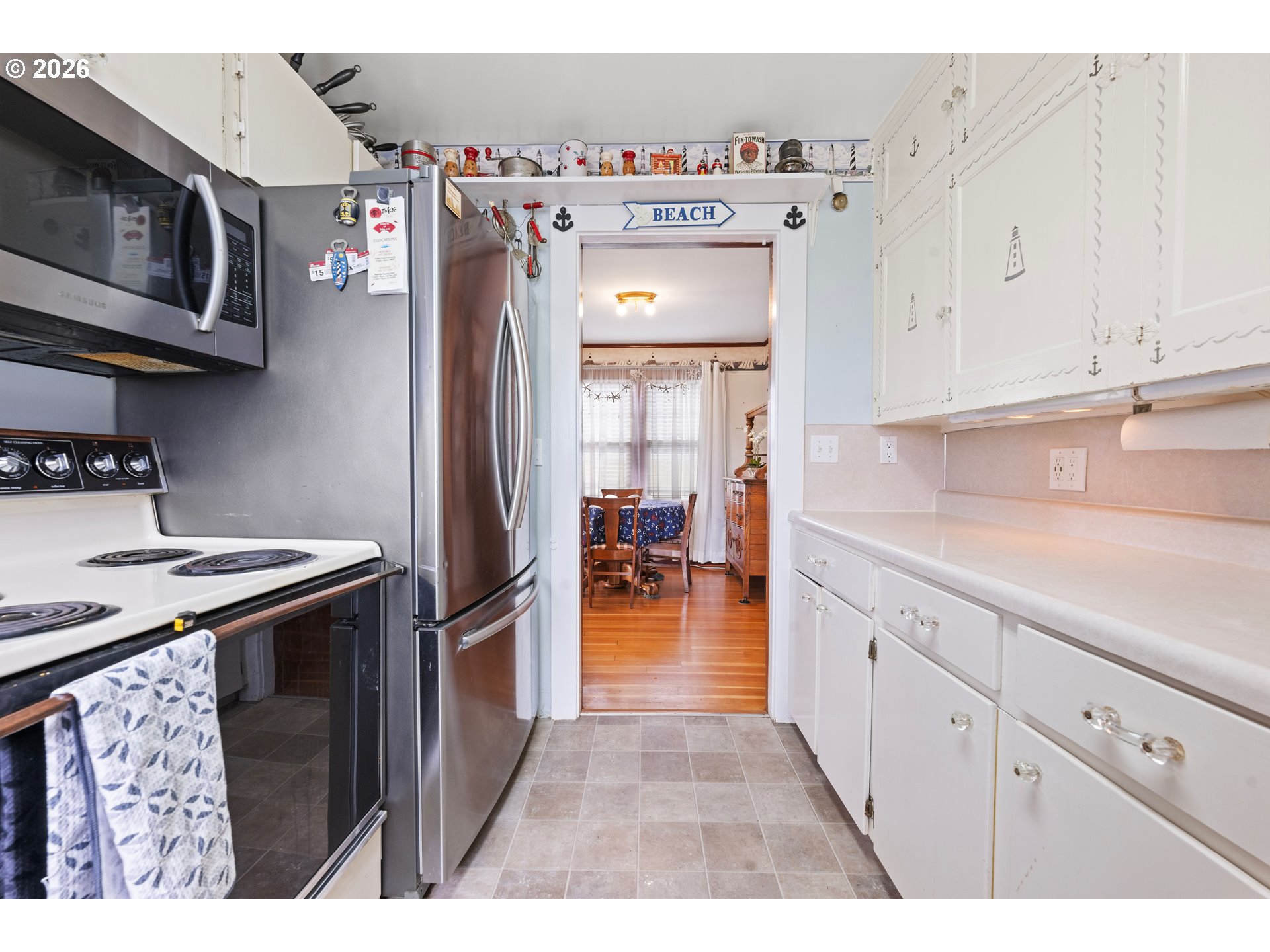 416 South Downing Street Seaside, OR 97138 - Photo 29 of 48 a kitchen with stainless steel appliances granite countertop a refrigerator a stove and a sink