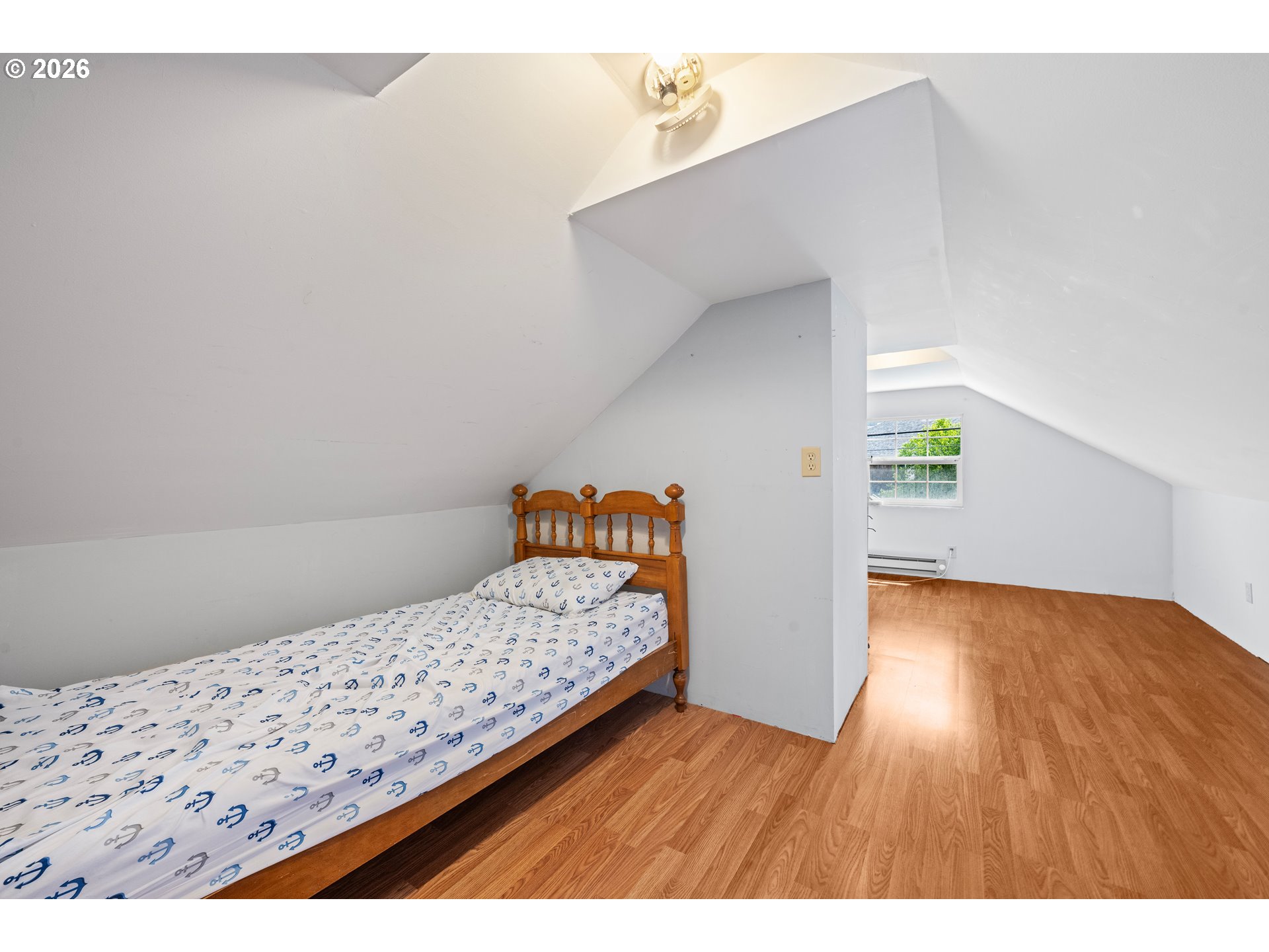 416 South Downing Street Seaside, OR 97138 - Photo 46 of 48 a bedroom with a bed and a painting on the wall