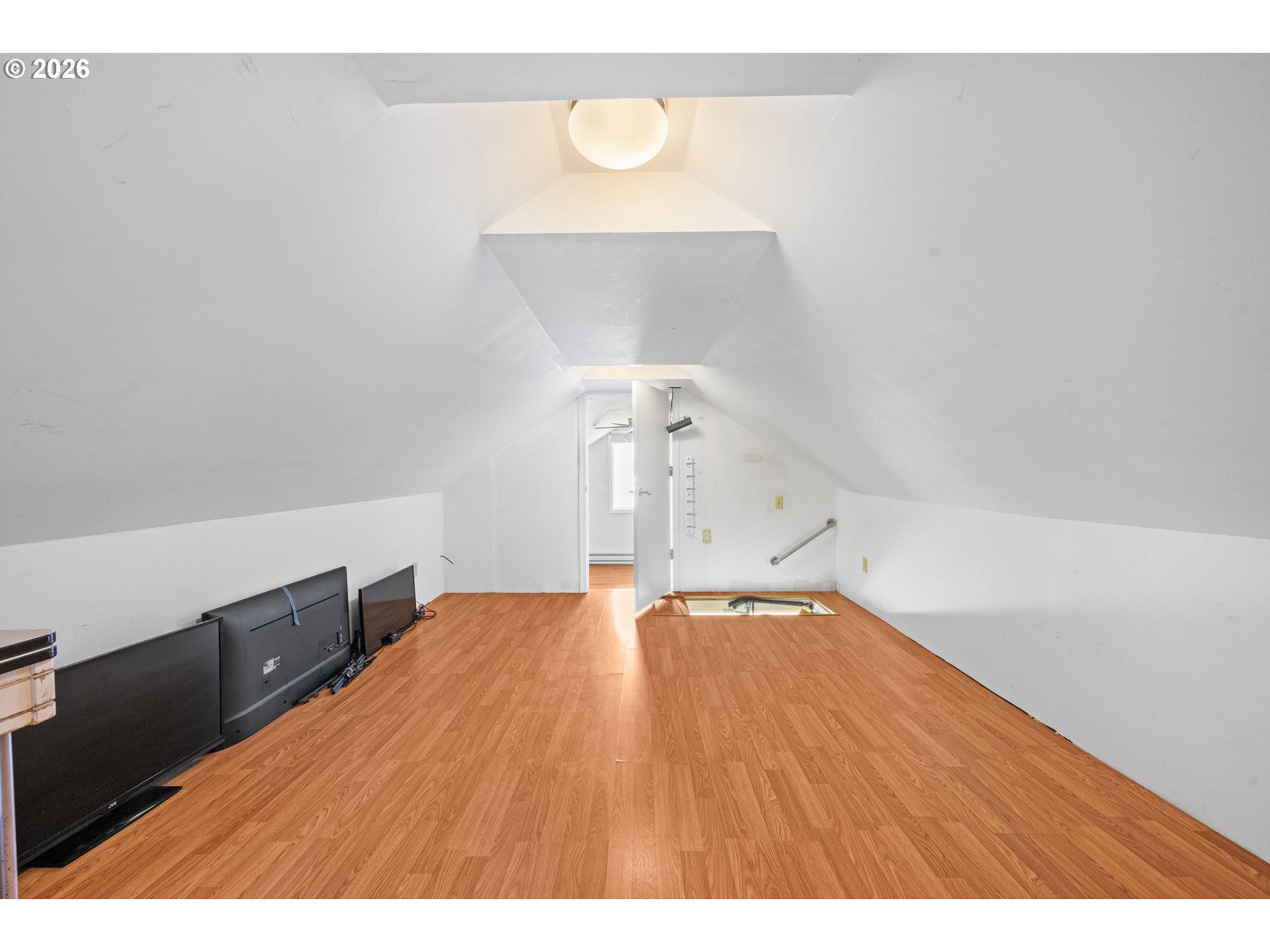 416 South Downing Street Seaside, OR 97138 - Photo 47 of 48 a view of an empty room with wooden floor