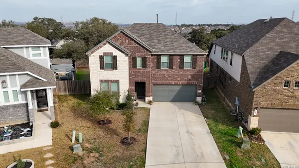 a aerial view of a house with a yard