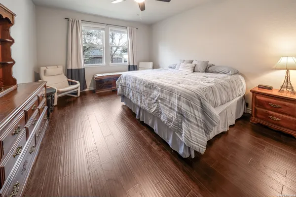 a bed room with a bed and a chair