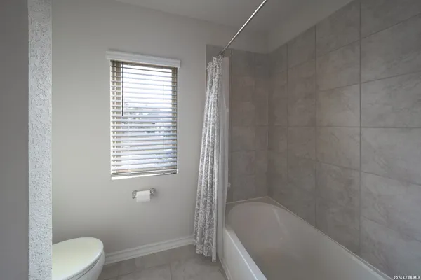 a bathroom with a sink a toilet and bathtub