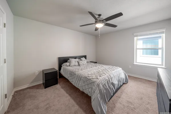 a bedroom with a bed and window