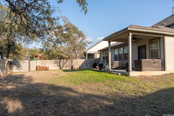 a view of a house with backyard porch and garden