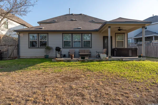 a view of house with a yard