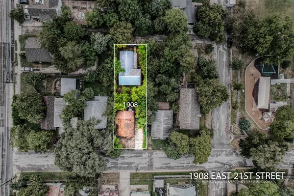 an aerial view of a house with outdoor space