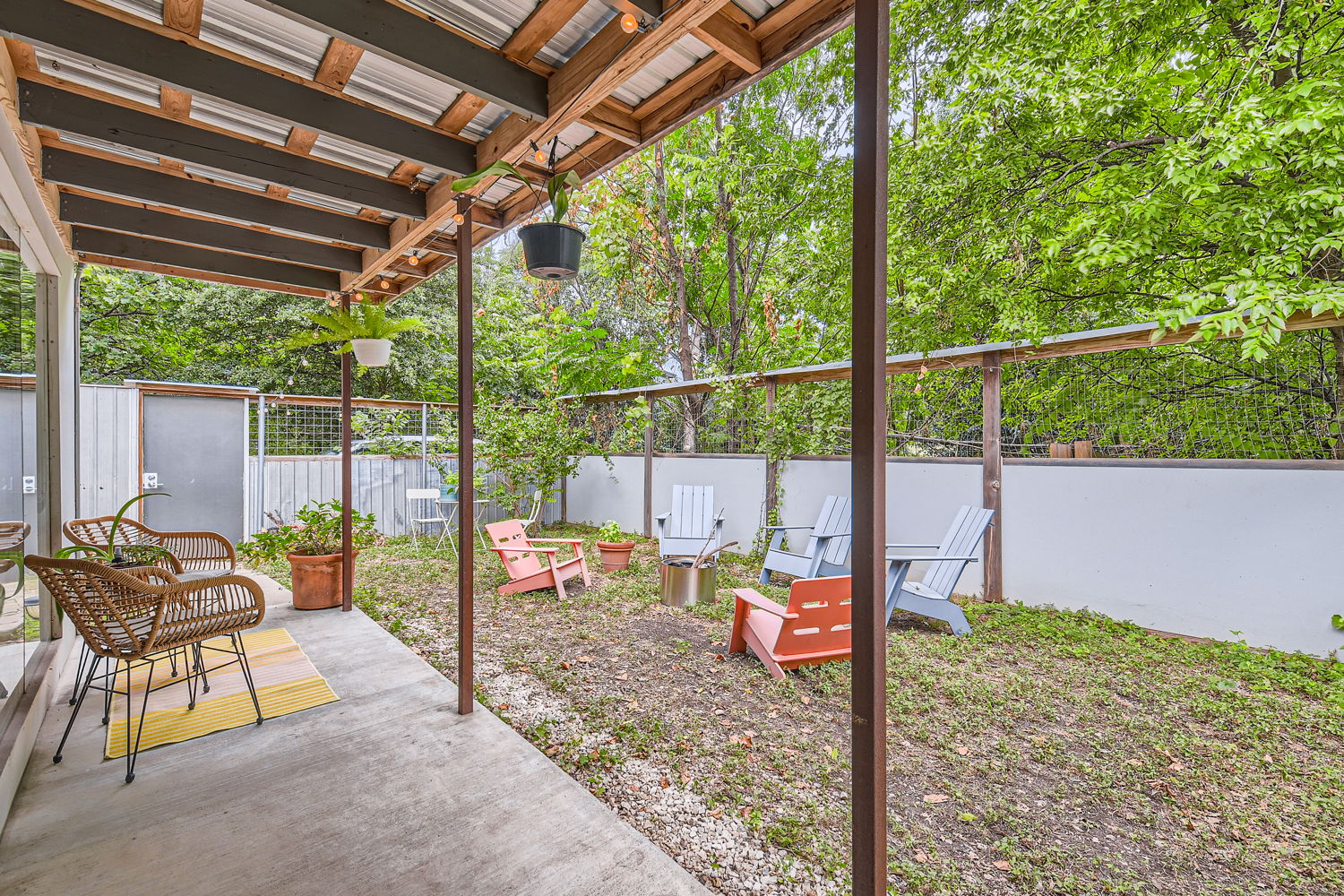 1908 East 21st Street, Unit 1 AND 2 Austin, TX 78722 - Photo 16 of 38 Spacious concrete patio facing metal fencing and front yard of Unit 2