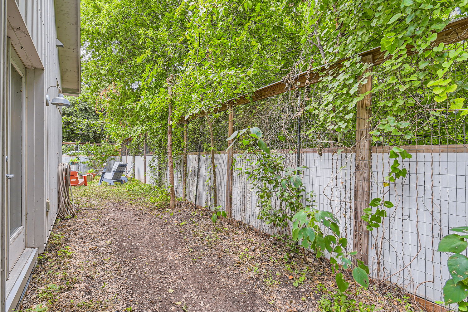 1908 East 21st Street, Unit 1 AND 2 Austin, TX 78722 - Photo 18 of 38 a view of a backyard with wooden fence