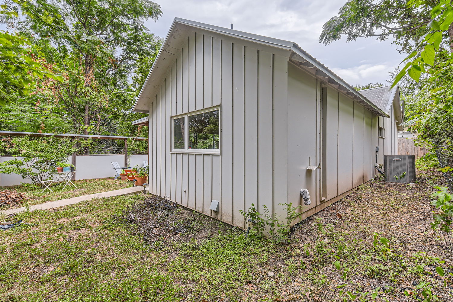 1908 East 21st Street, Unit 1 AND 2 Austin, TX 78722 - Photo 19 of 38 View of side of property featuring board and batten siding and fence