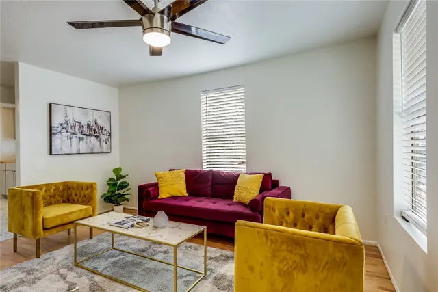 a living room with furniture and a window