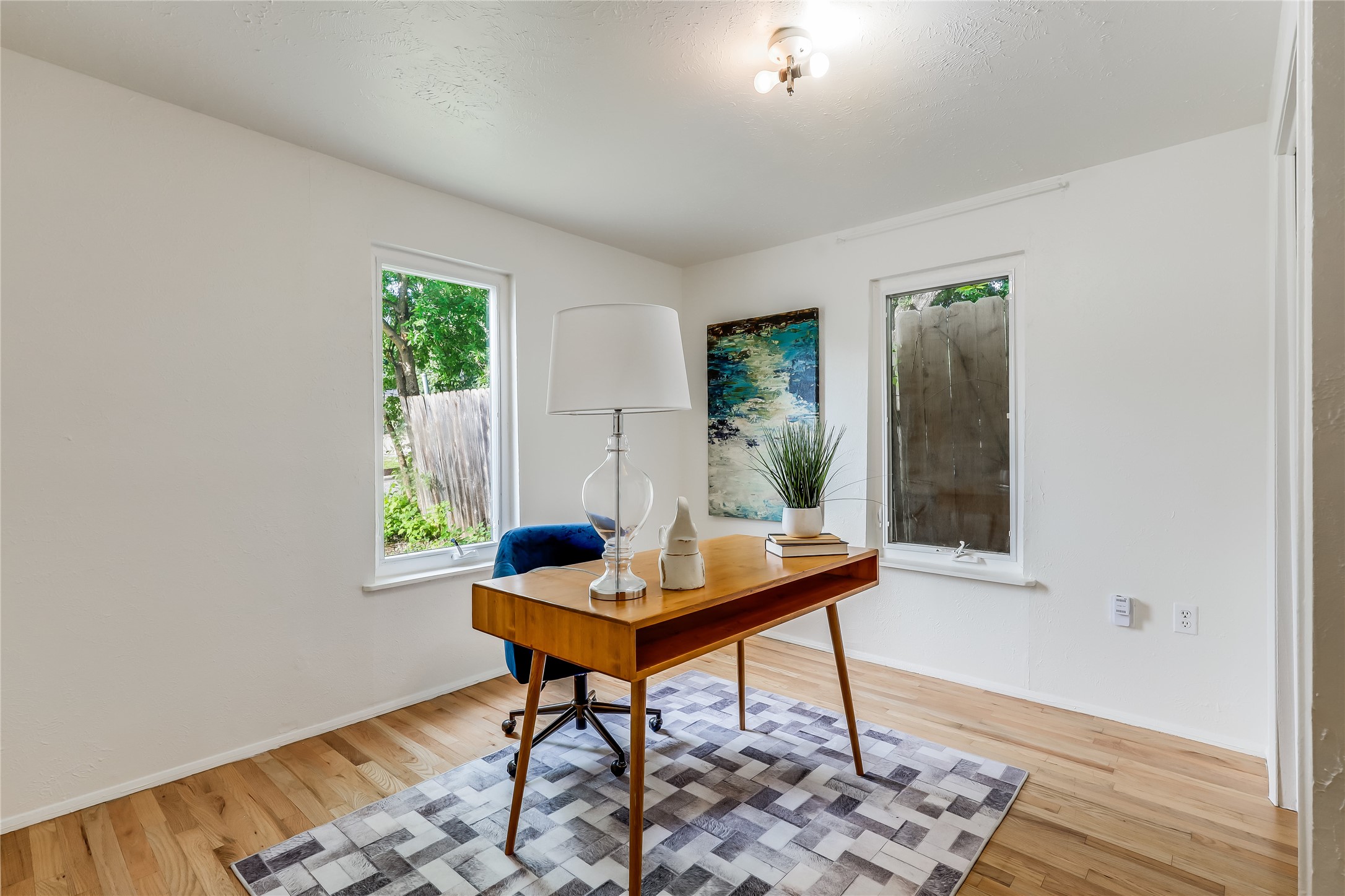 1908 East 21st Street, Unit 1 AND 2 Austin, TX 78722 - Photo 27 of 38 a work room with furniture and a potted plant
