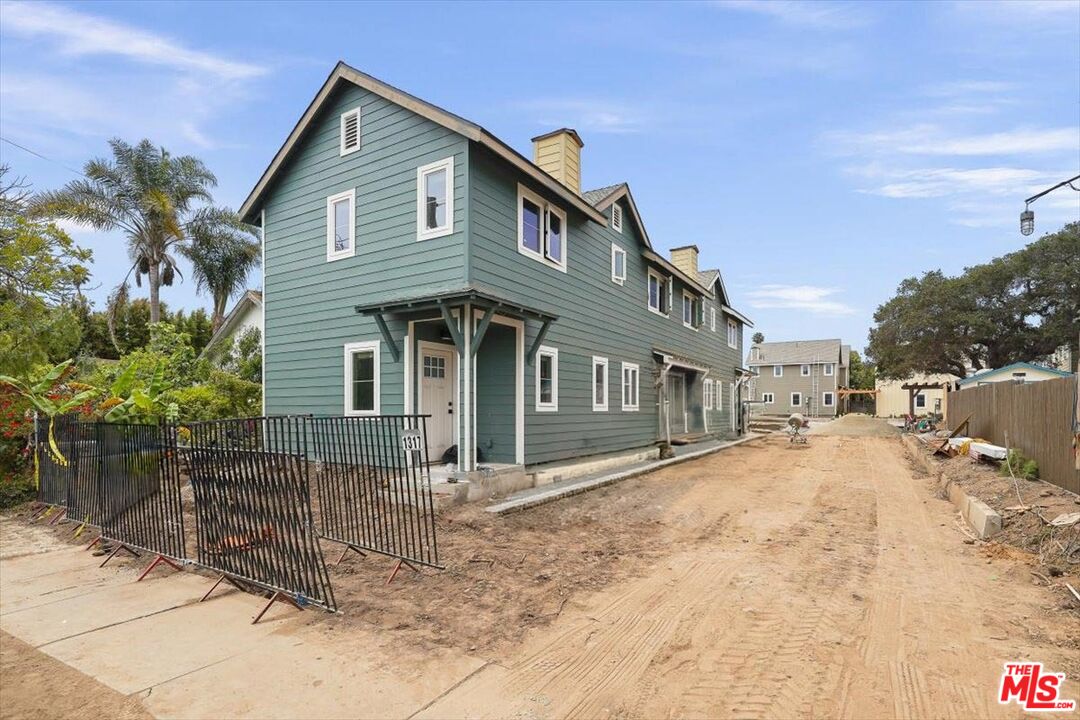 1317 Punta Gorda Street, Unit 11 Santa Barbara, CA 93103 - Photo 31 of 70 a front view of a house with a yard covered with snow in front of house