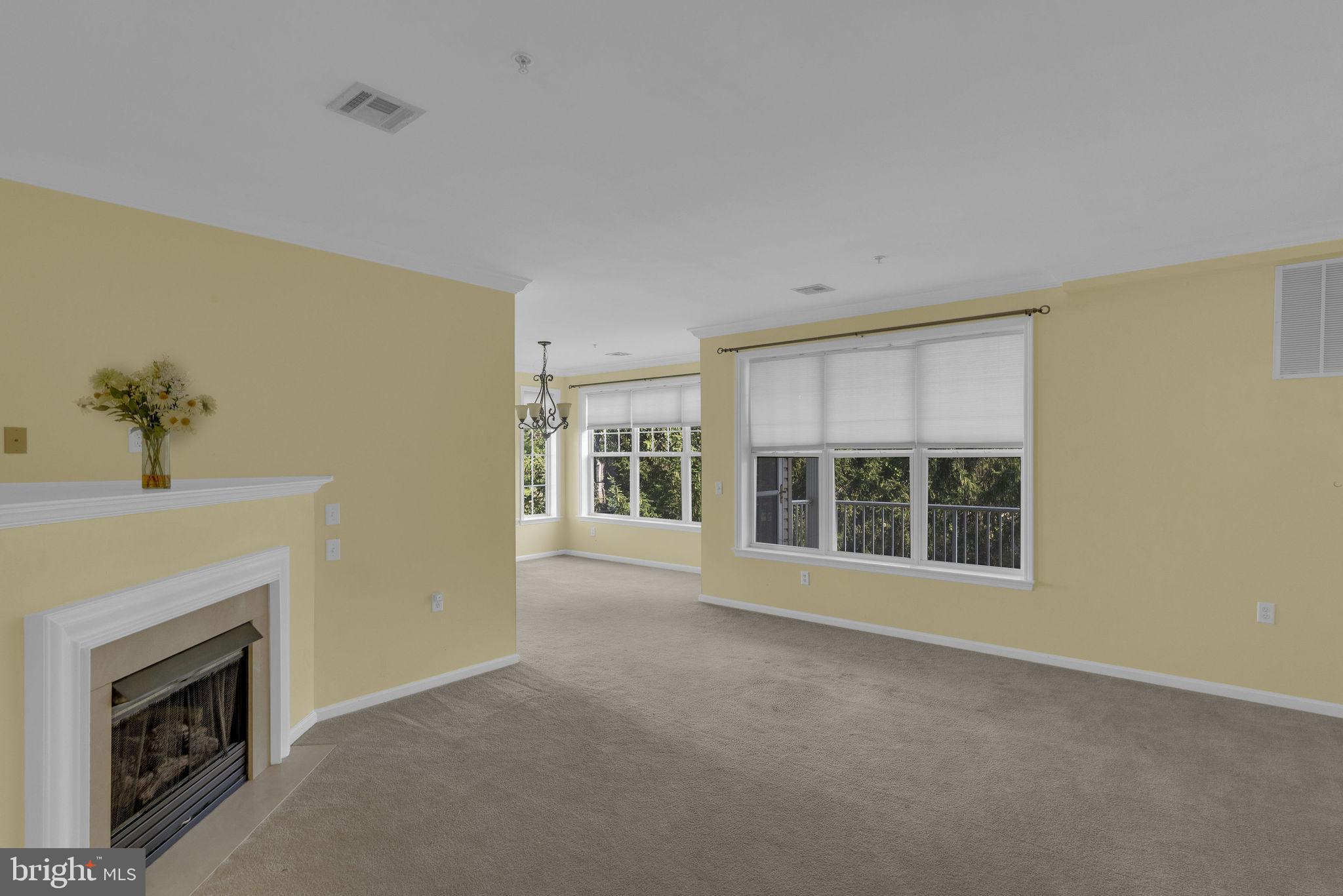 222 Masterson Court Ewing, NJ 08618 - Photo 12 of 43 a view of an empty room with a fireplace