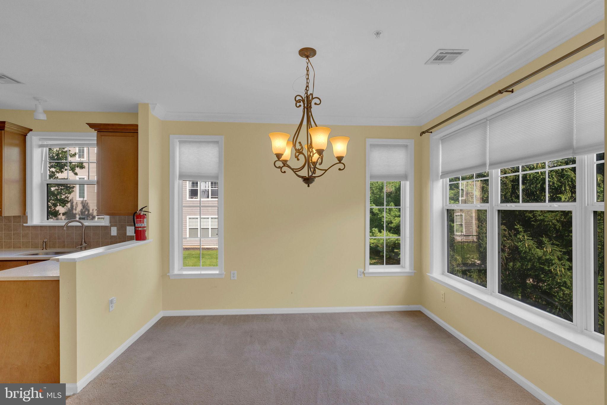 222 Masterson Court Ewing, NJ 08618 - Photo 13 of 43 a view of a windows and chandelier in a room