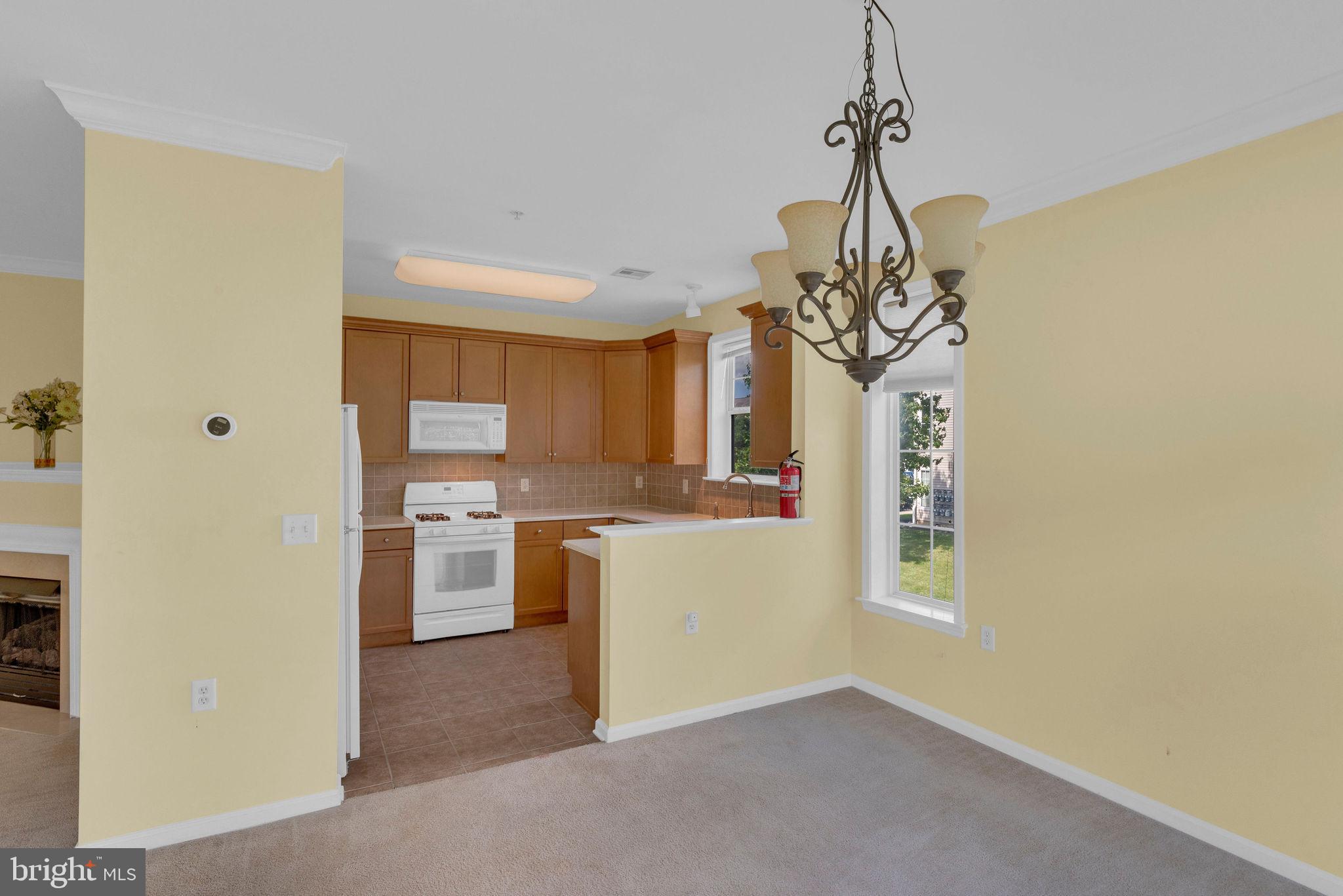 222 Masterson Court Ewing, NJ 08618 - Photo 17 of 43 a kitchen that has a lot of cabinets in it