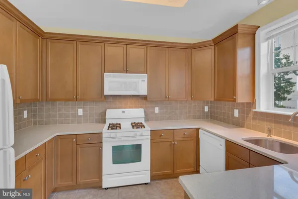 a kitchen with a sink and a window