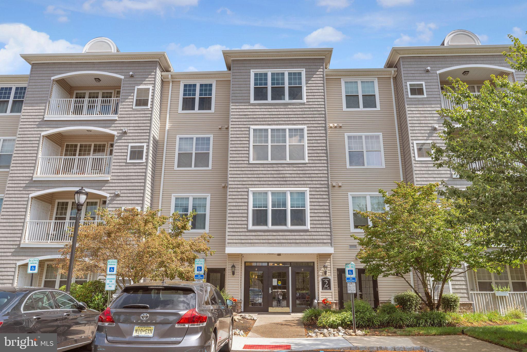 222 Masterson Court Ewing, NJ 08618 - Photo 2 of 43 a front view of a building with street view