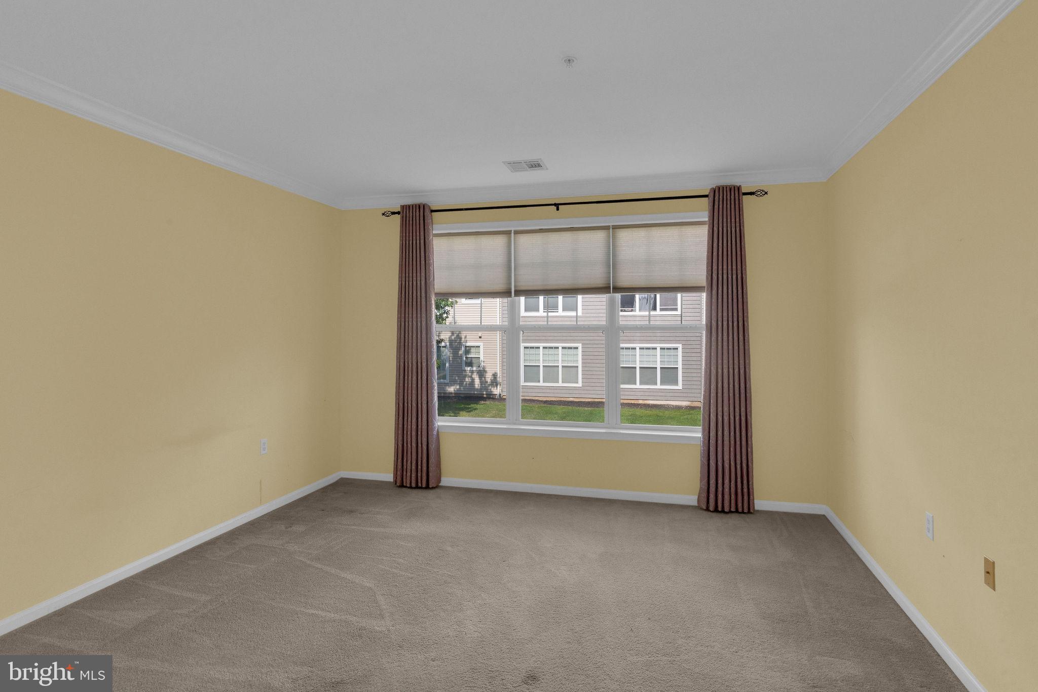 222 Masterson Court Ewing, NJ 08618 - Photo 23 of 43 a view of an empty room with a window