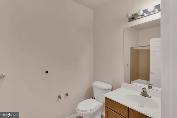 a bathroom with a shower and a toilet