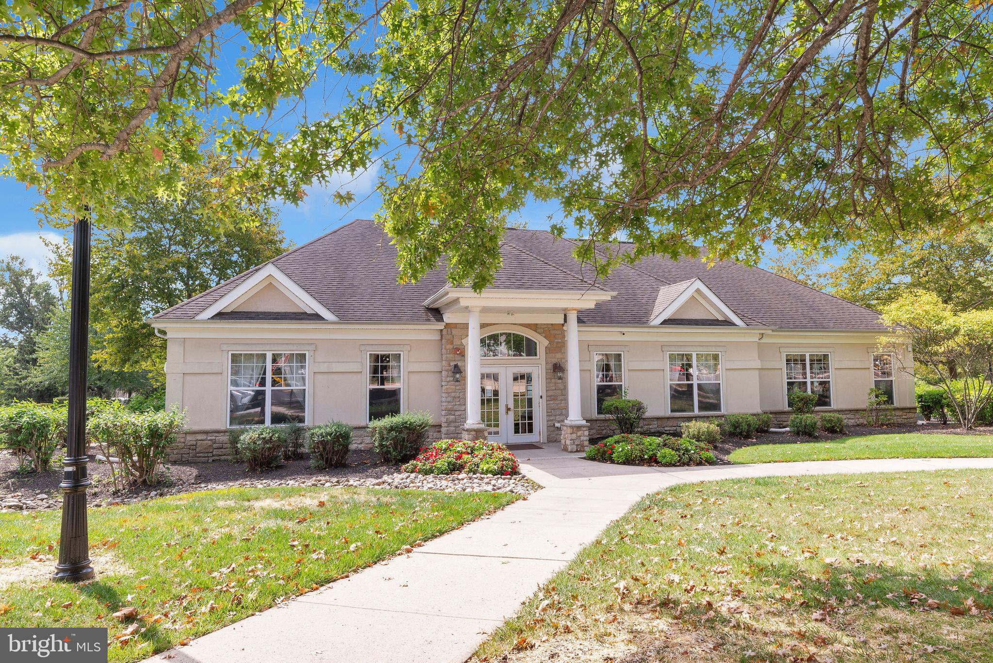 222 Masterson Court Ewing, NJ 08618 - Photo 33 of 43 a front view of a house with a yard