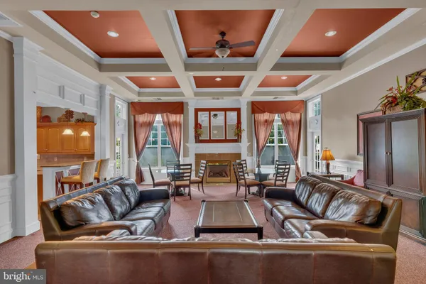 a living room with fireplace furniture and a flat screen tv