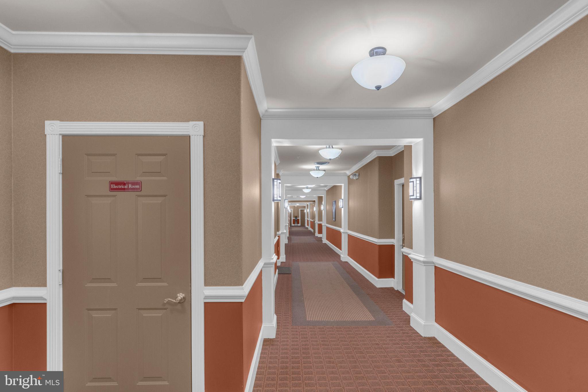 222 Masterson Court Ewing, NJ 08618 - Photo 5 of 43 a hallway with wooden floor and chandelier