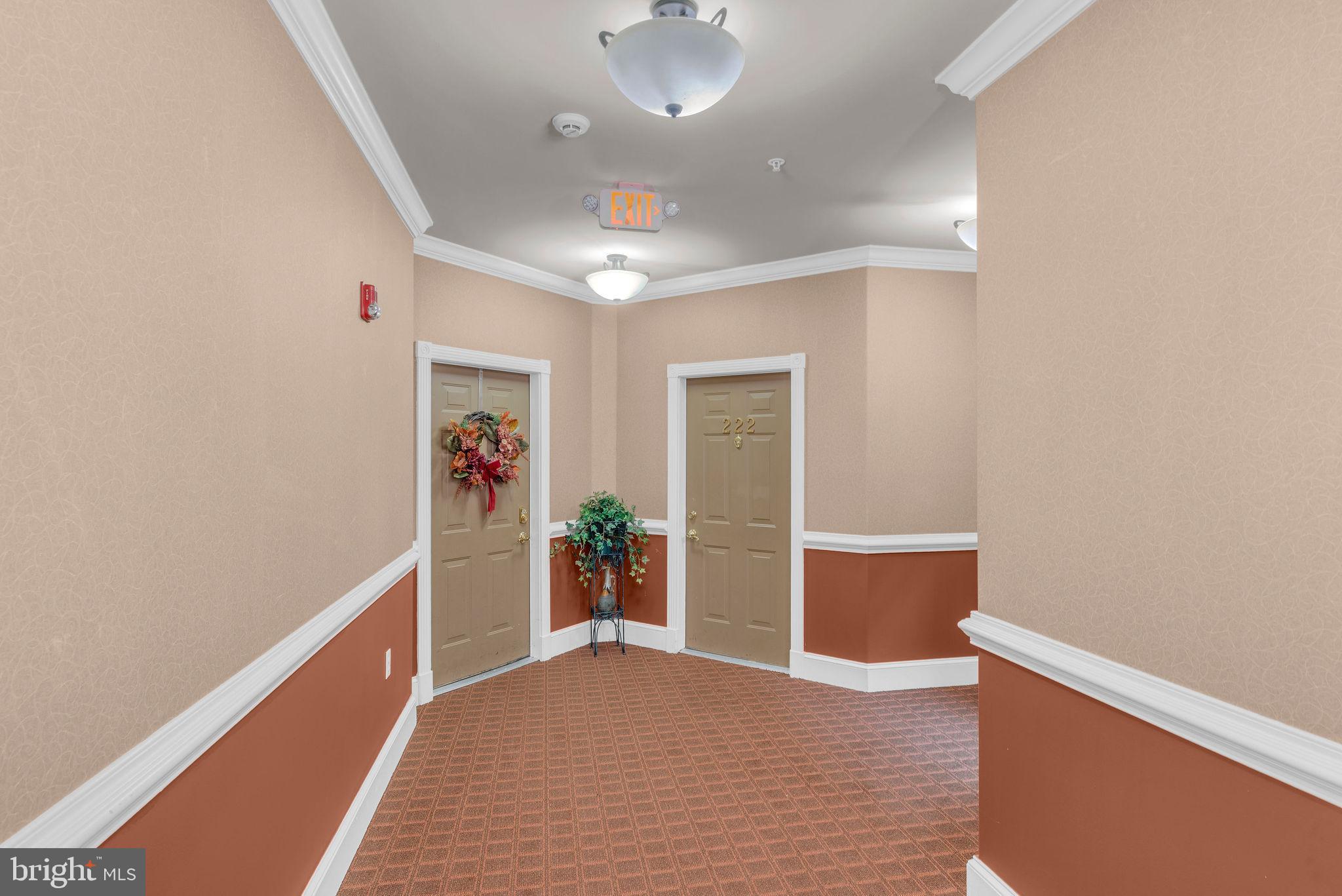 222 Masterson Court Ewing, NJ 08618 - Photo 6 of 43 a view of hallway with wooden floor