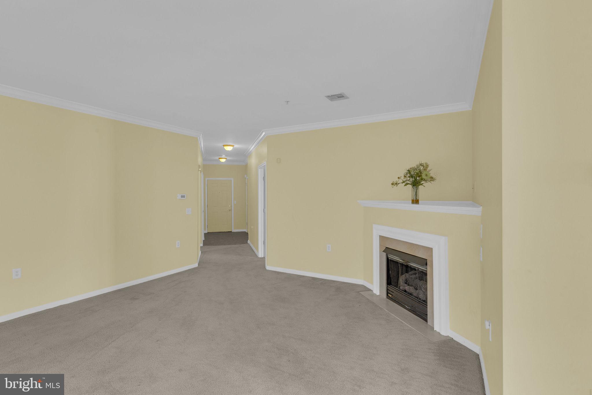 222 Masterson Court Ewing, NJ 08618 - Photo 9 of 43 a view of an empty room with a fireplace