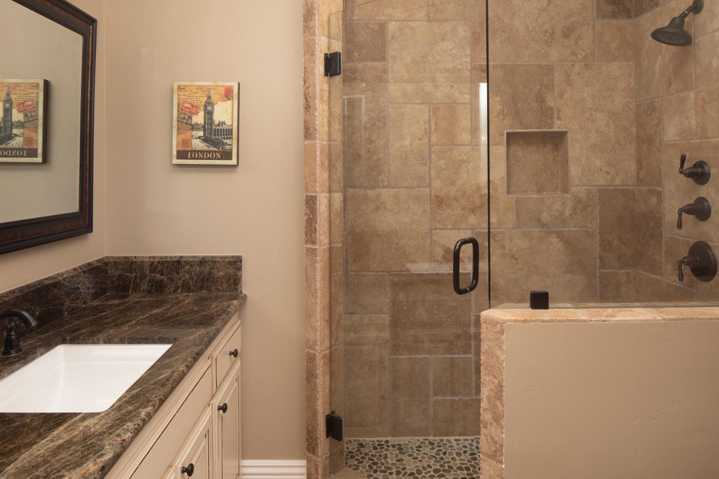10448 Fairway Lane Carmel, CA 93923 - Photo 16 of 21 a bathroom with a granite countertop bathtub sink vanity and shower