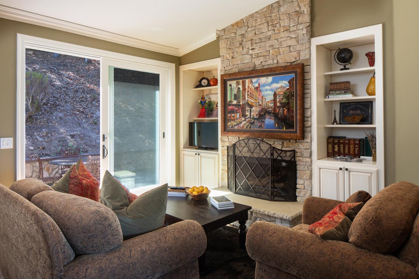 10448 Fairway Lane Carmel, CA 93923 - Photo 7 of 21 a living room with furniture a floor to ceiling window and a fireplace