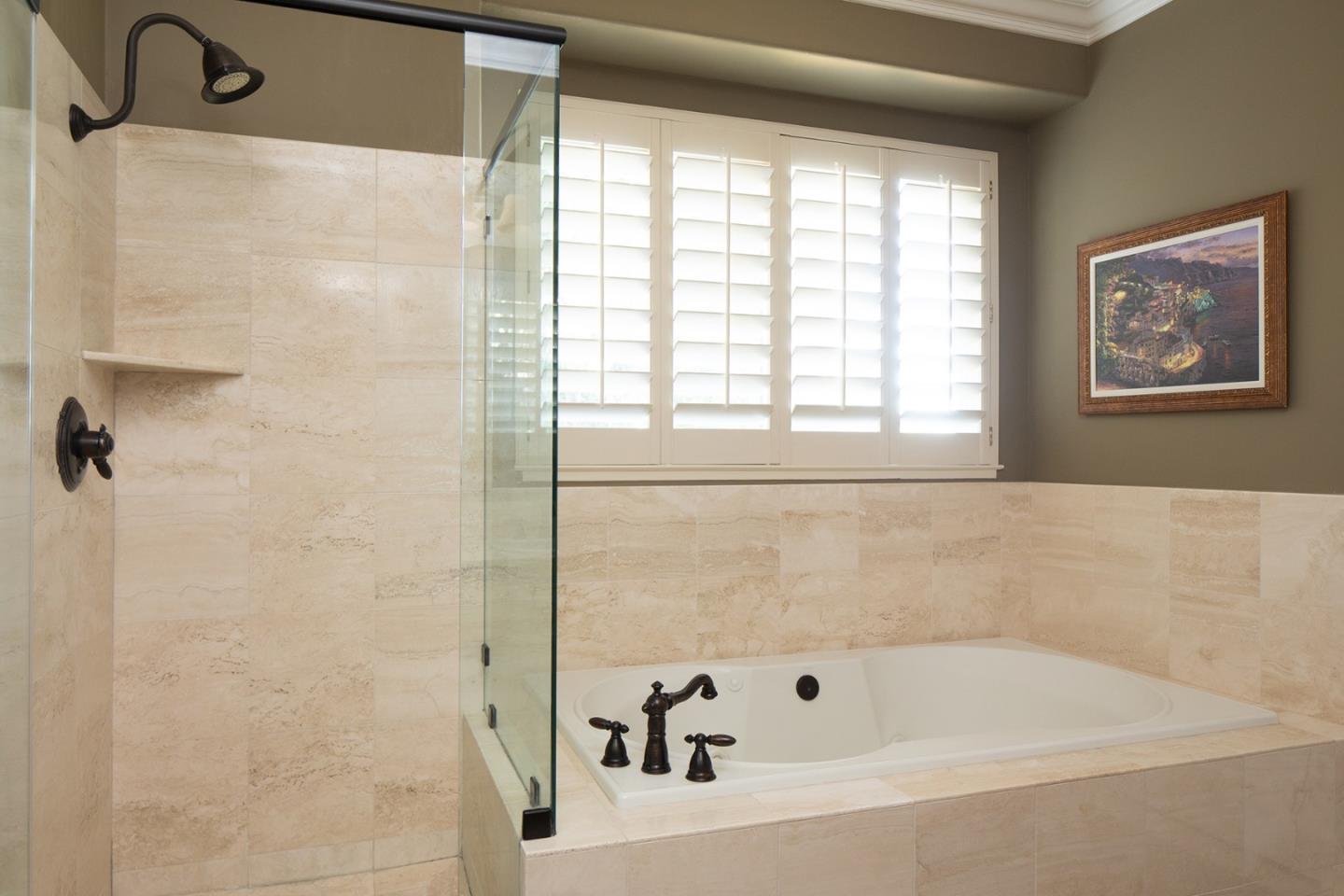 10448 Fairway Lane Carmel, CA 93923 - Photo 10 of 21 a bathroom with a bathtub and a shower