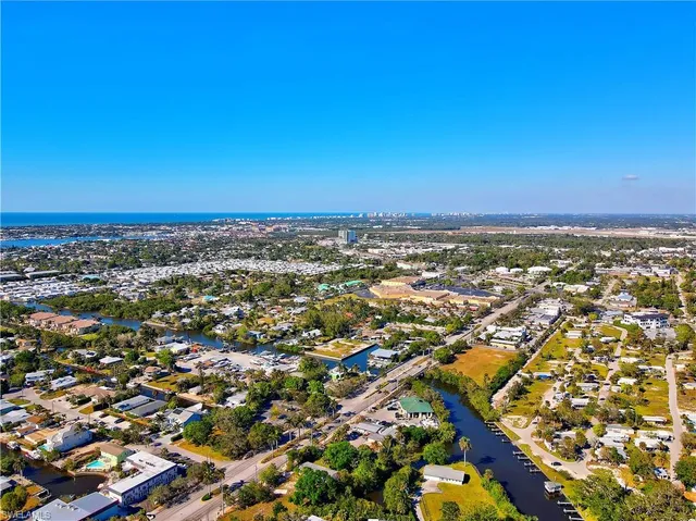 an aerial view of residential building and trees around