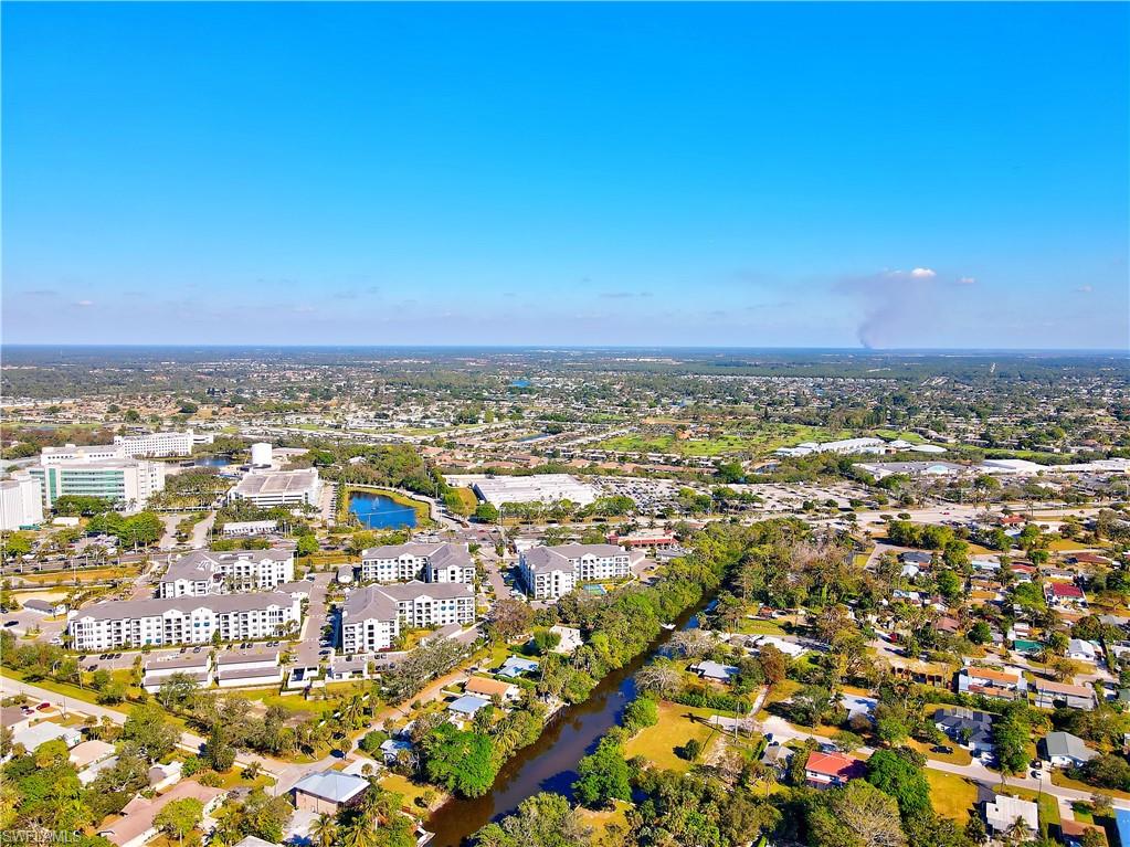 3054 Coco Avenue Naples, FL 34112 - Photo 9 of 13 an aerial view of residential houses with outdoor space