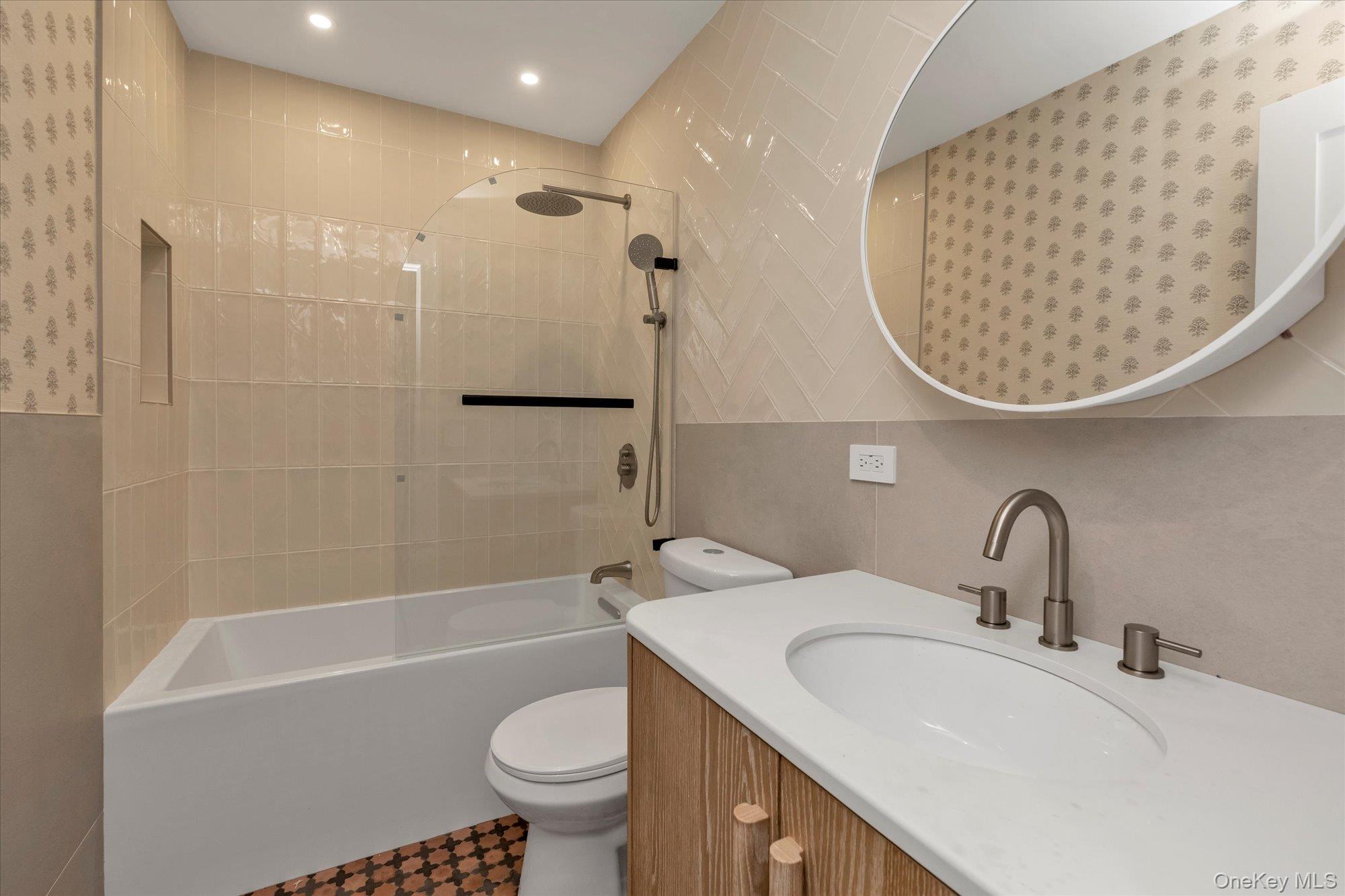 1497 Carroll Street Wantagh, NY 11793 - Photo 16 of 18 Bathroom featuring vanity, shower / bath combination, tile walls, and recessed lighting