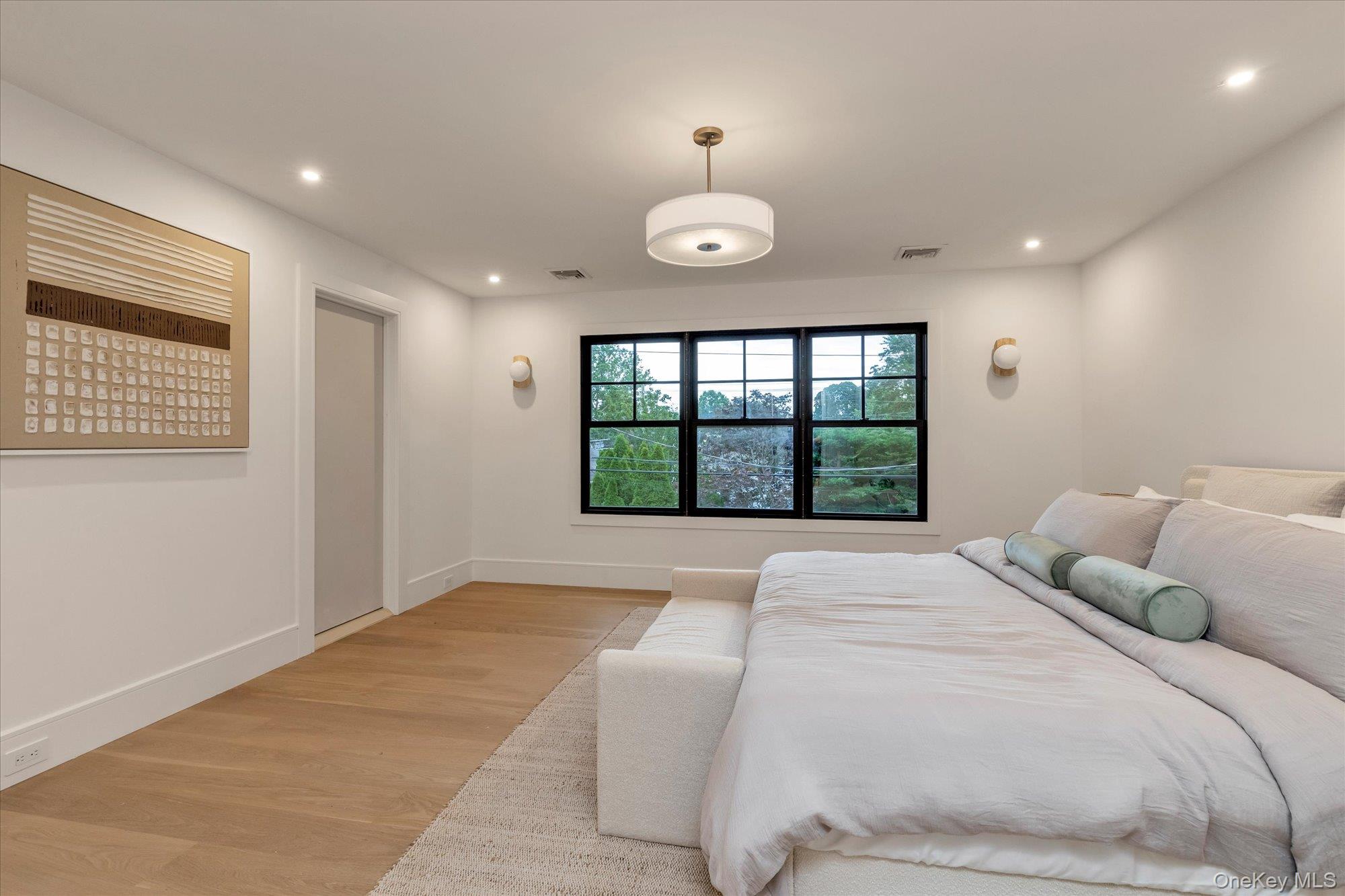 1497 Carroll Street Wantagh, NY 11793 - Photo 10 of 18 Bedroom with light wood-type flooring and recessed lighting