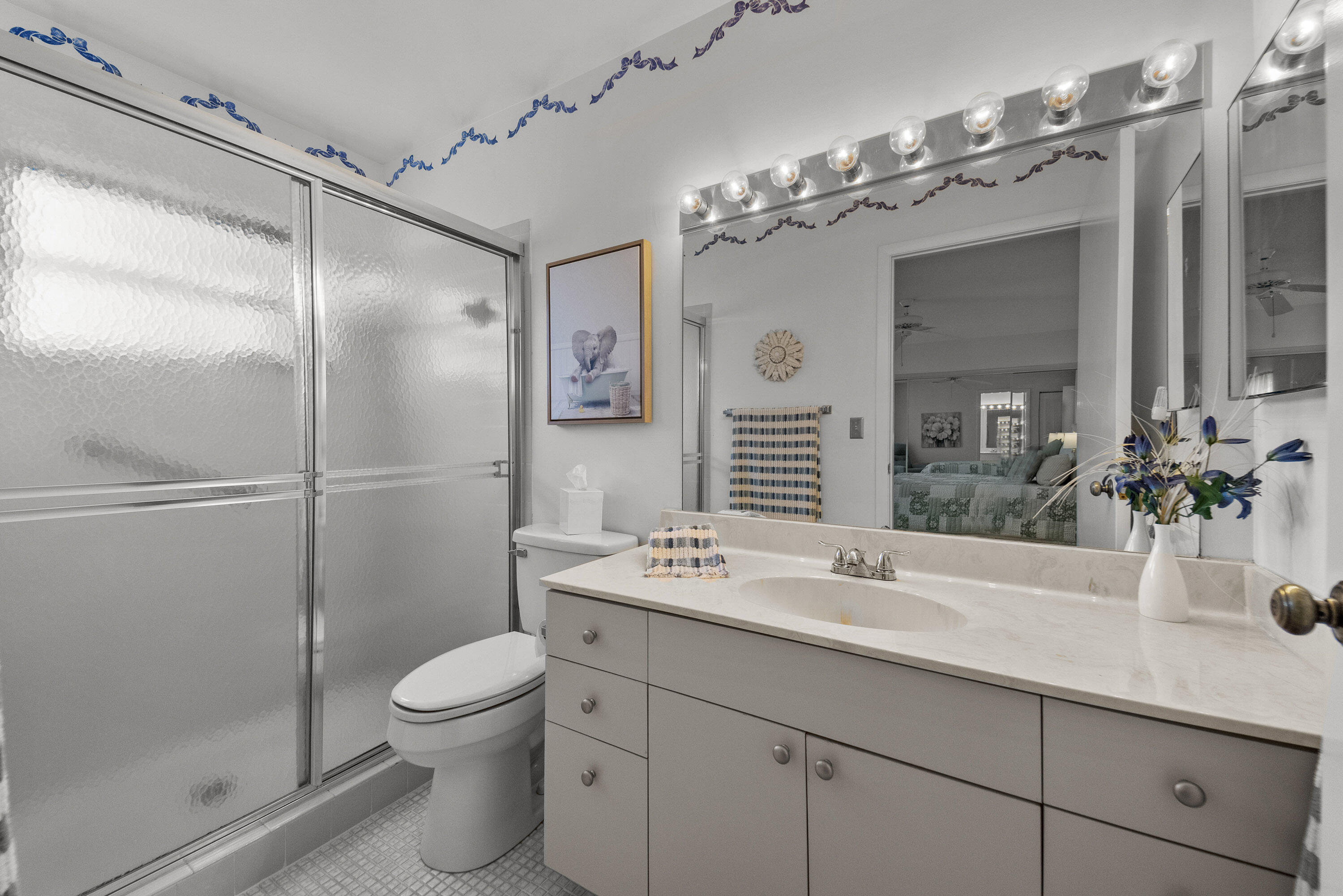 5080 Nesting Way, Unit A Delray Beach, FL 33484 - Photo 12 of 37 a bathroom with a sink toilet and shower