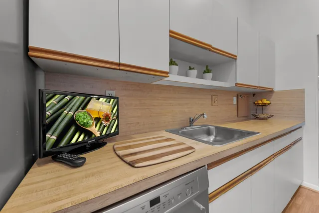 a kitchen that has a stove and a table in it