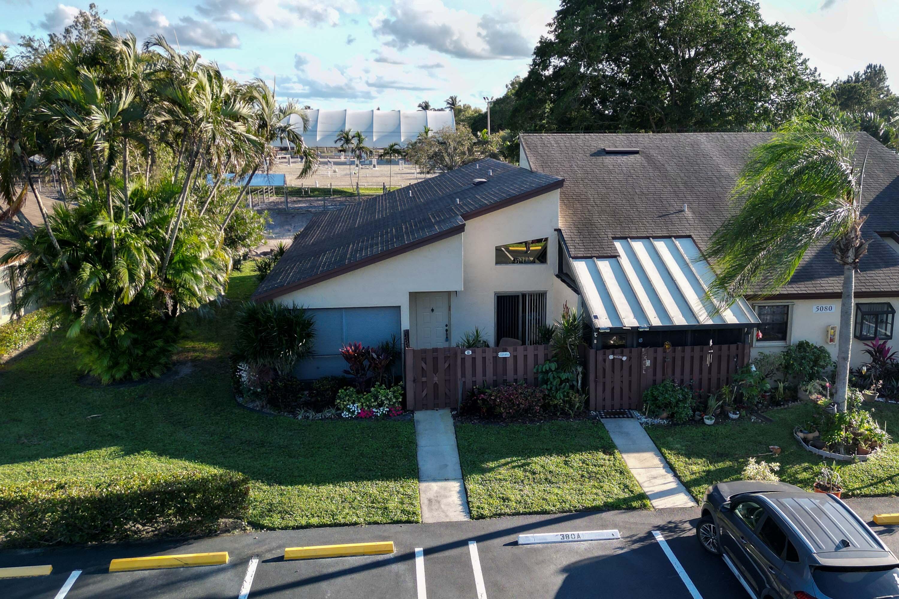 5080 Nesting Way, Unit A Delray Beach, FL 33484 - Photo 34 of 37 front view of house with a yard