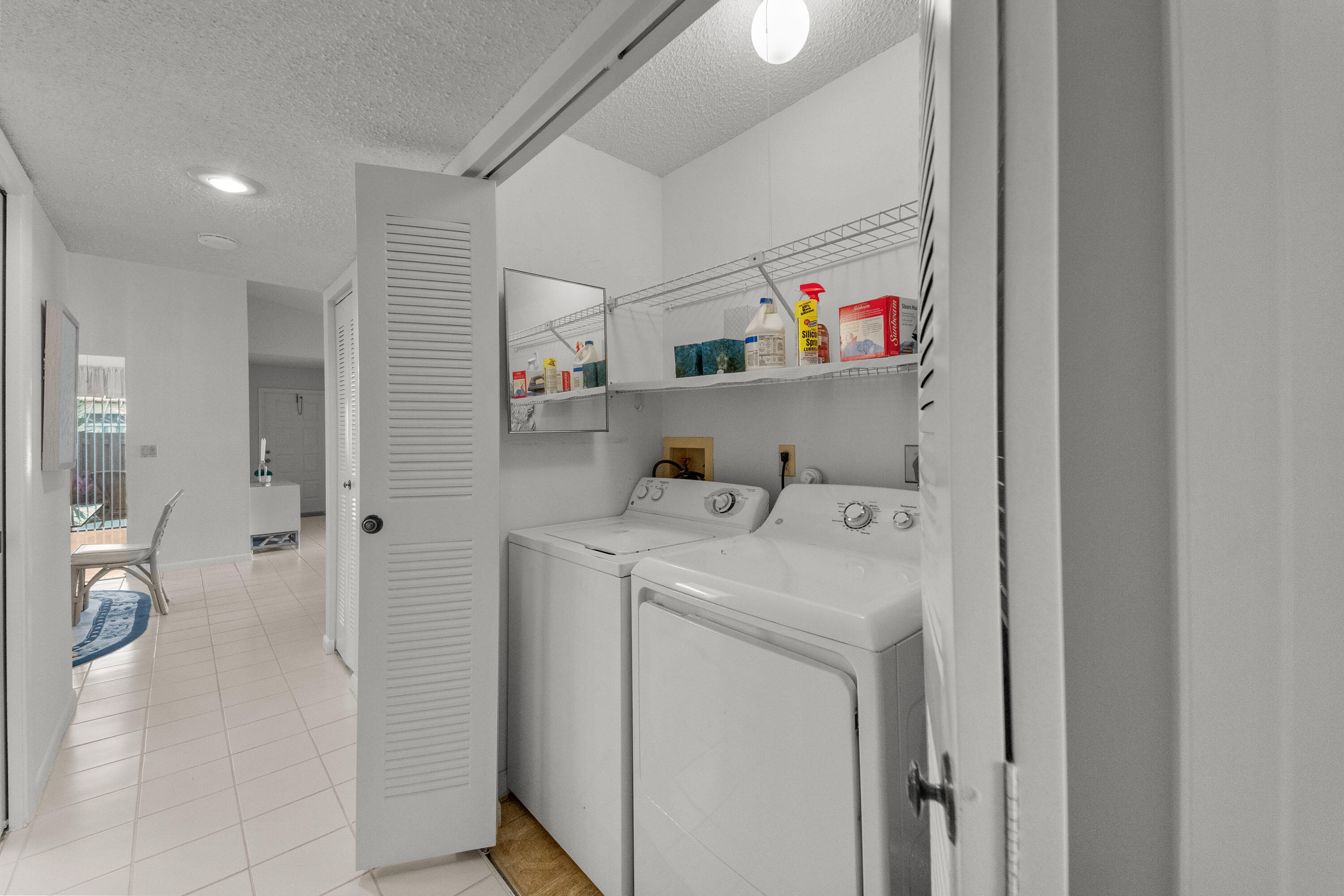 5080 Nesting Way, Unit A Delray Beach, FL 33484 - Photo 8 of 37 a utility room with dryer and washer