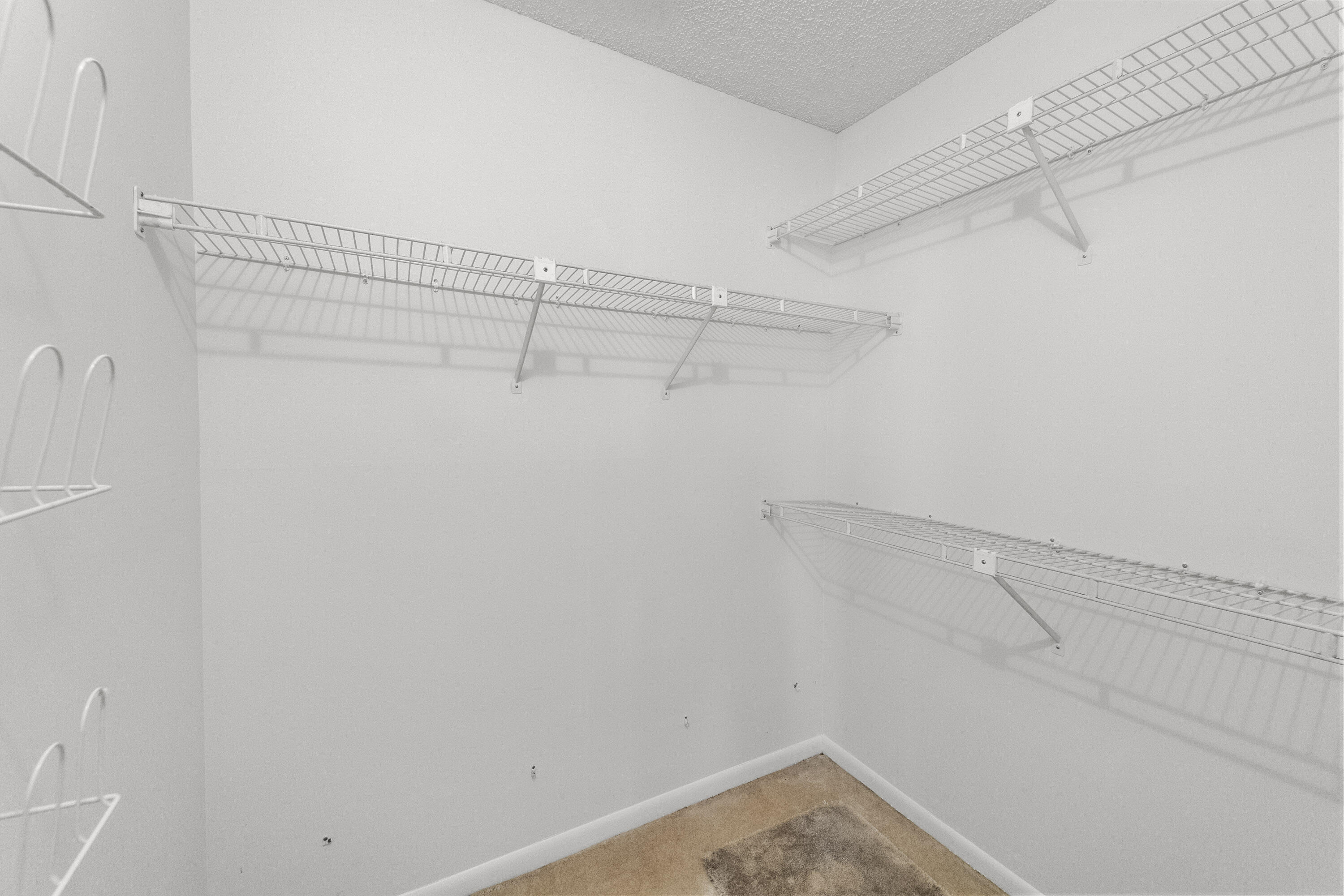 5080 Nesting Way, Unit A Delray Beach, FL 33484 - Photo 9 of 37 a view of a room with racks on the wall