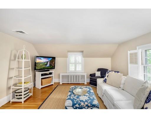 12 Cleveland Road Wellesley, MA 02481 - Photo 14 of 25 a living room with furniture a flat screen tv and a window